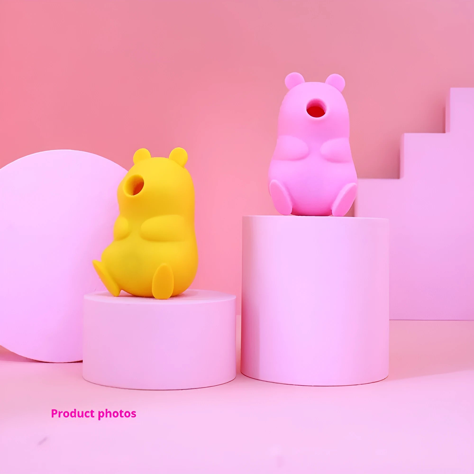 Cute bear-shaped silicone suction massage device in pink and yellow with magnetic charging cable