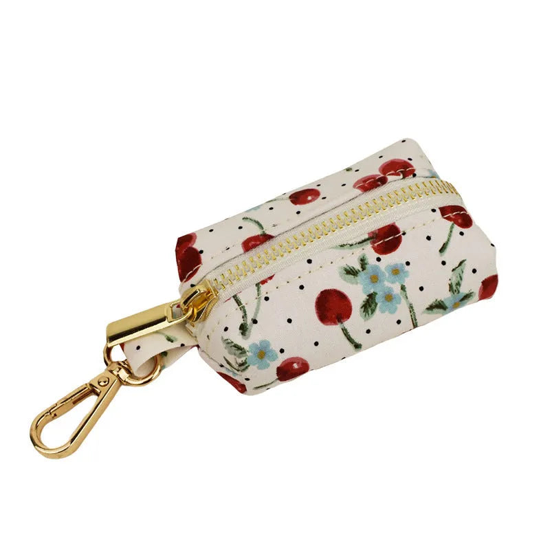 Red cherry printed dog collar and leash set with light gold buckle and bow on cloth material