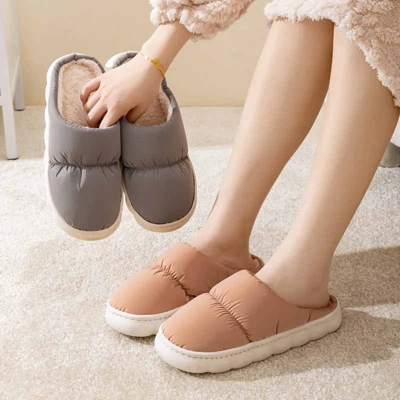 Pair of down cotton slippers with artificial leather upper and thick rubber sole, shown in available colours.