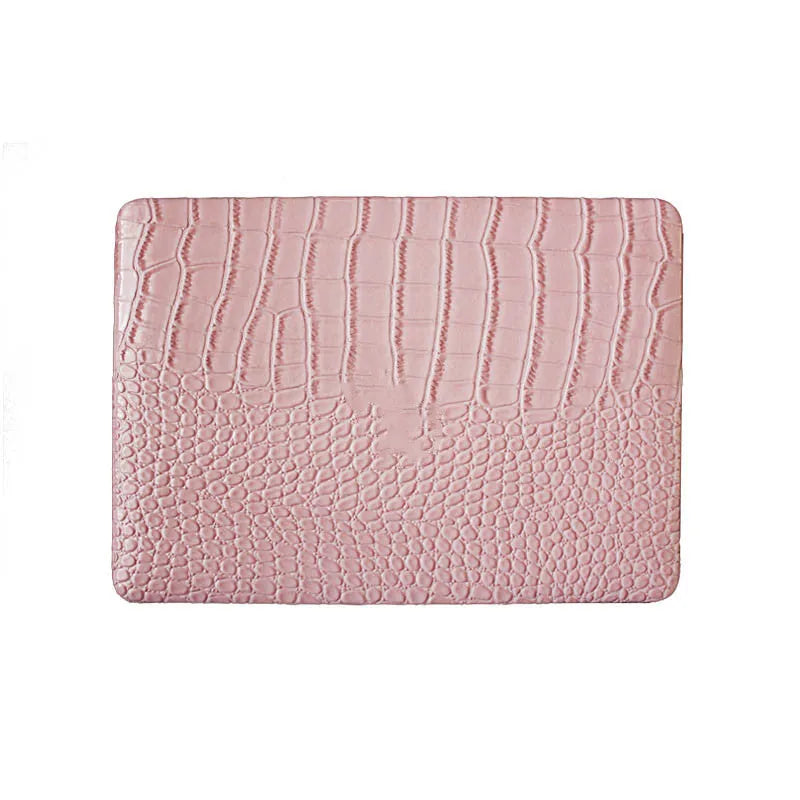 Pink MacBook protective case with bubble pattern and colourful stickers, compatible with 11-inch to 16-inch models.