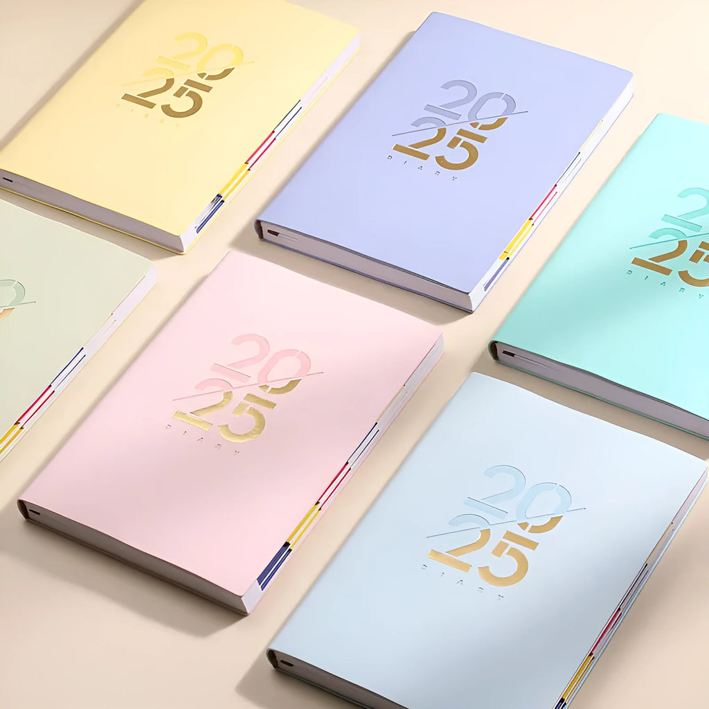 A5 2025 daily planner book with soft faux leather cover in blue colour, showing binding and open pages.