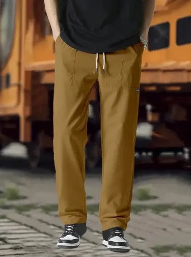 Men's light grey polyester casual trousers for spring and autumn wear.