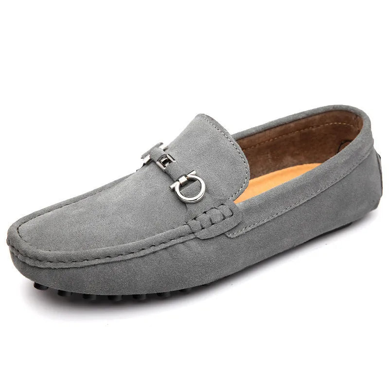 Men's black matte cowhide slip-on shoe with square toe and visible stitching on a plain background.