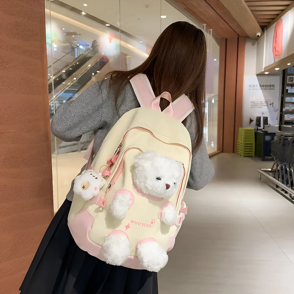 Nylon school backpack with curved shoulder straps in macaron colours including yellow pink