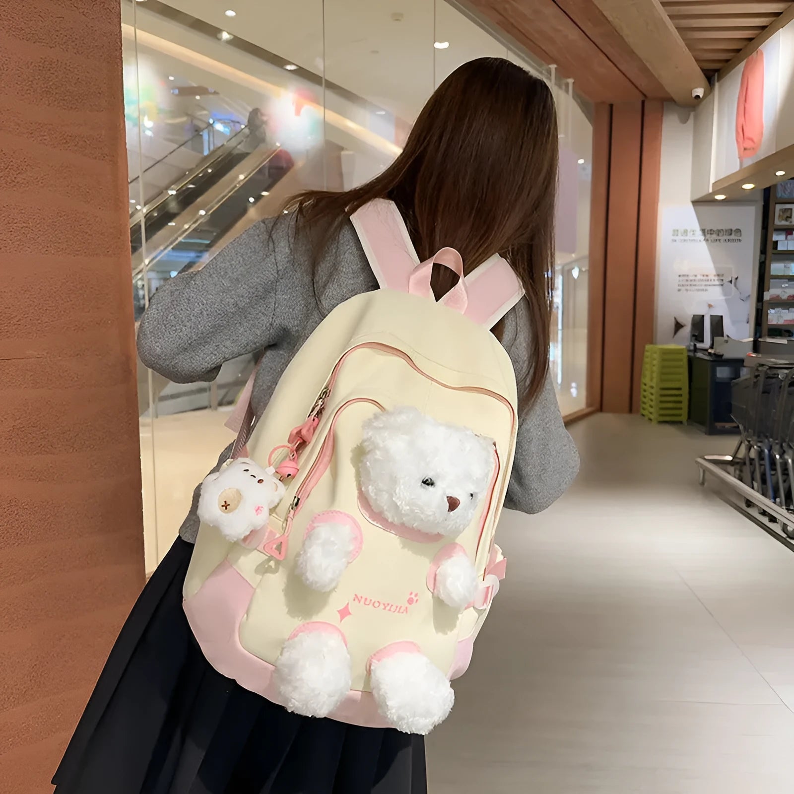 Nylon school backpack with curved shoulder straps in macaron colours including yellow pink