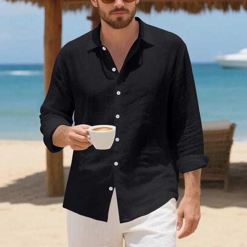 A man wearing a loose-fit light blue linen casual shirt with a non-iron finish, buttoned front and standard collar.