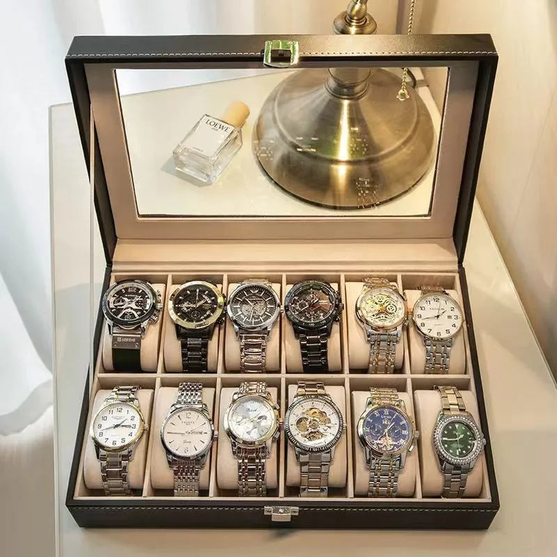Grey leather watch storage box with a transparent dust cover, showing internal watch slots.