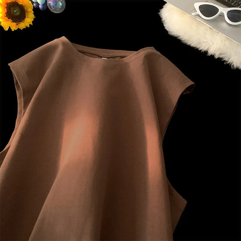 Men's loose fit solid colour cotton tank top shown in a selection of available colours and sizes.