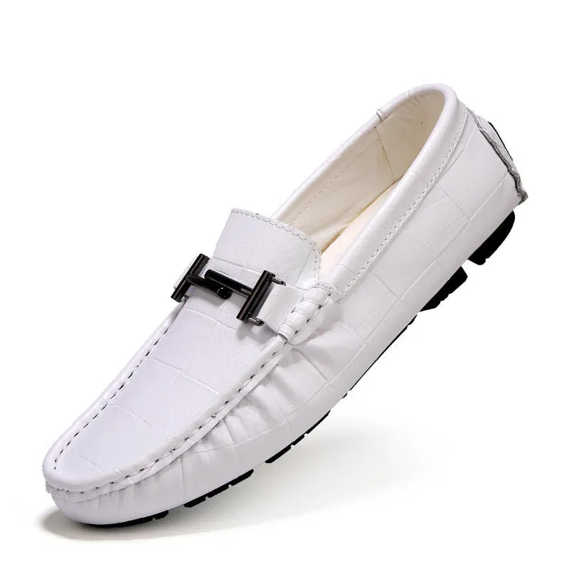 Men's black leather casual loafers with a silver buckle strap on a rubber sole.