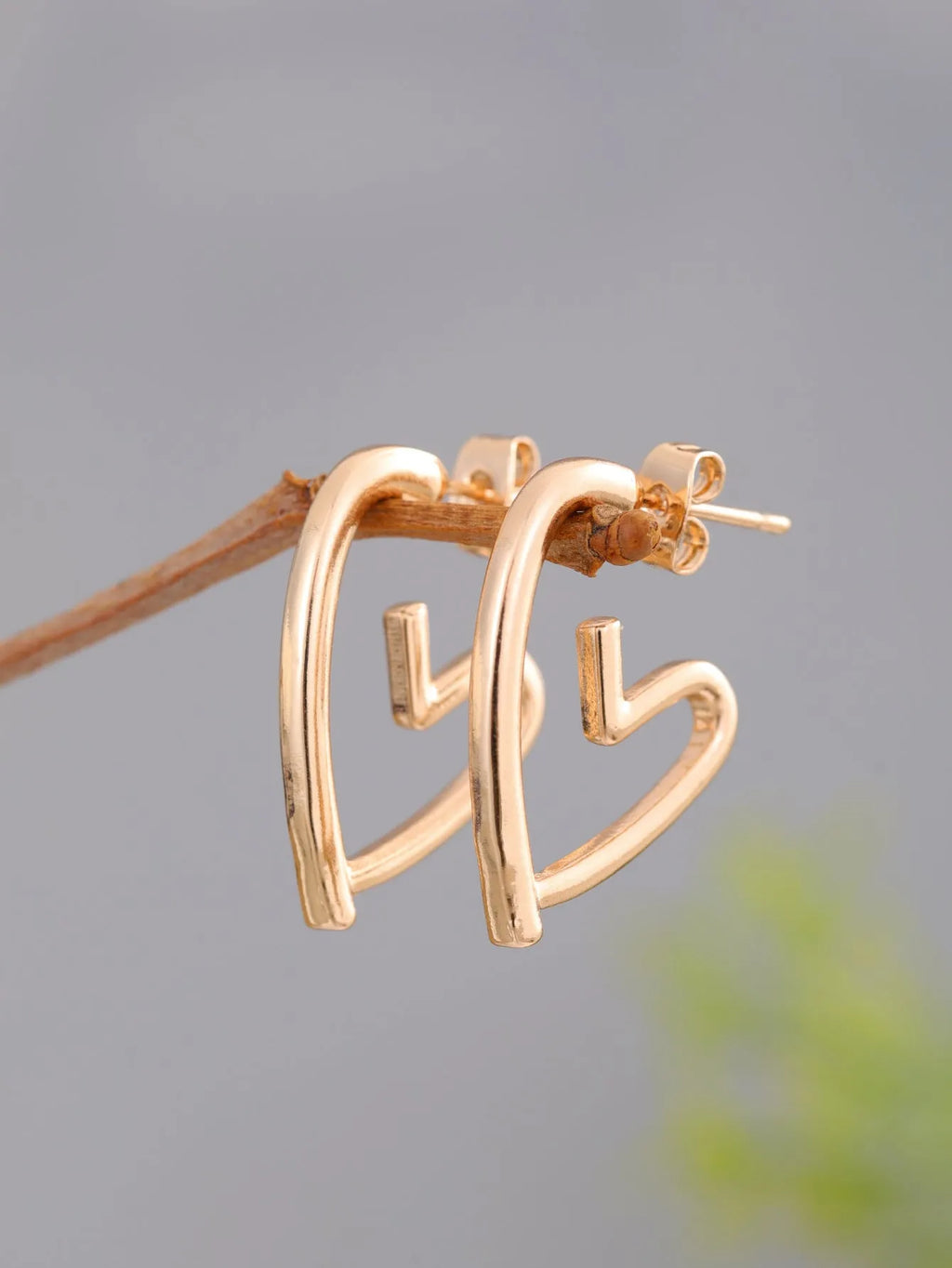 Simple cold style love earrings for women in golden colour metal alloy finish