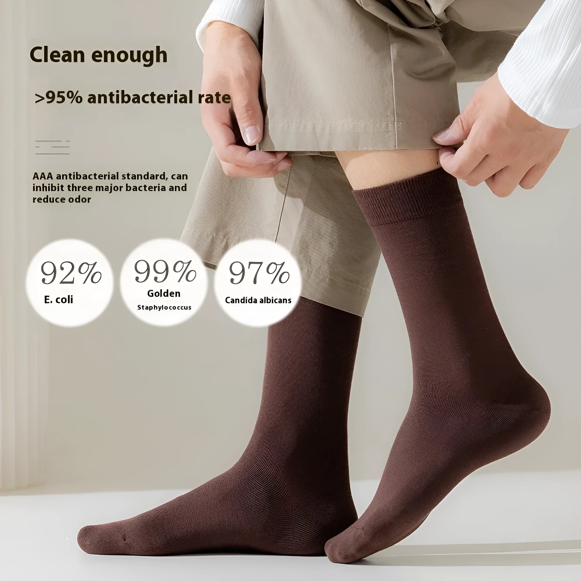Five pairs of men's solid colour mid-calf socks made from combed cotton, shown in assorted colours.