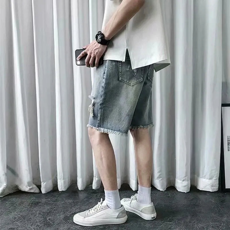 Men's thin ripped denim shorts in retro colour with handmade distressing, Bermuda length, size L