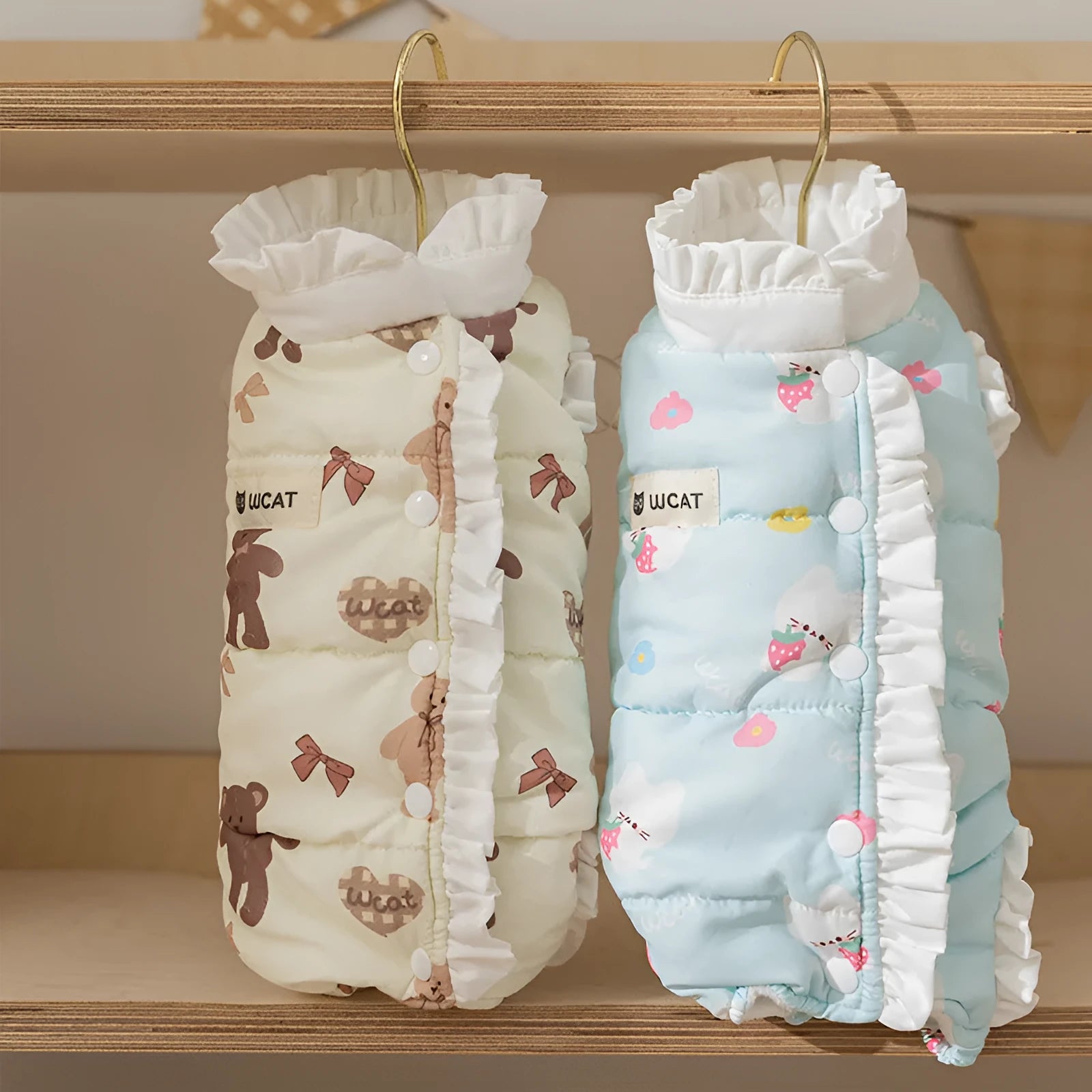 Cream fleece pet jumpsuit with bear print and white ruffles, four-legged design on small dog