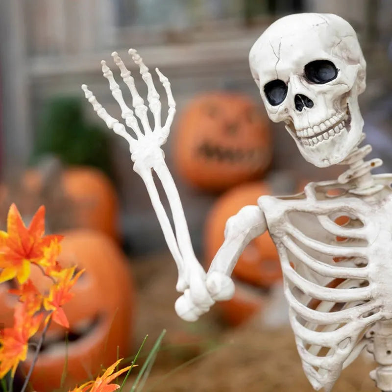 Poseable 90cm tall plastic skeleton Halloween decoration with articulated limbs.