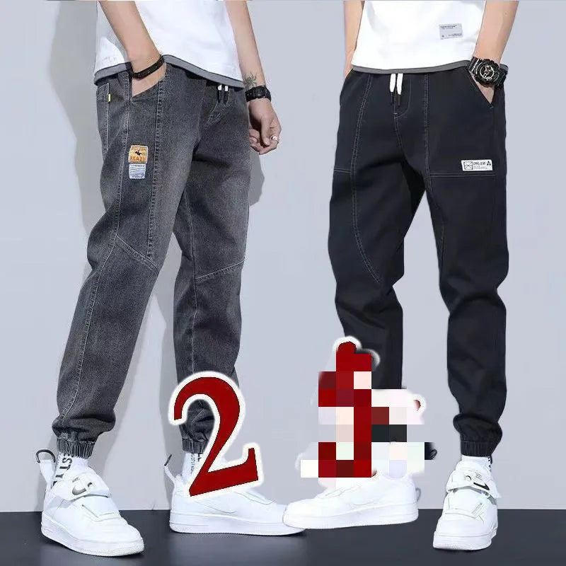 Two pairs of women's casual cotton jeans with mid waist and washed finish in grey and black