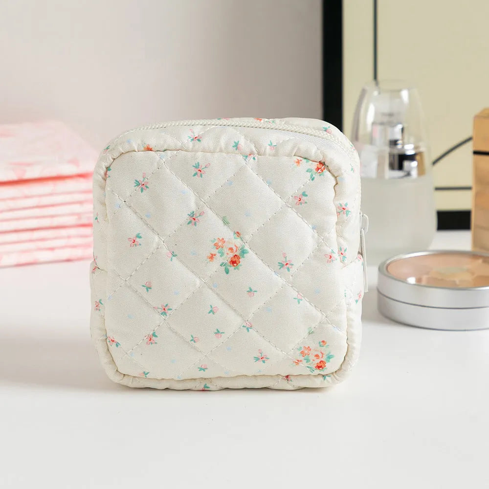 Floral pattern key storage bag made from breathable polyester fabric in various colour options.