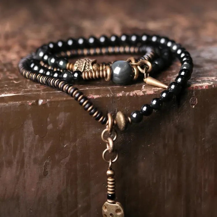 Black retro colourful geometric beaded bracelet with a multi-layered design.