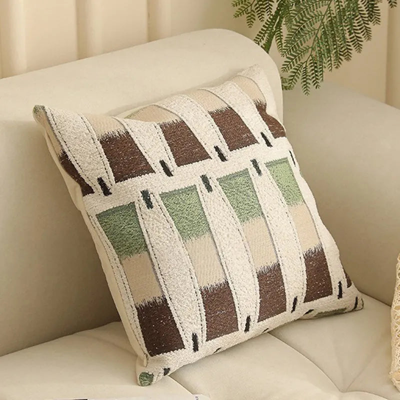 Square jacquard pillow cover with retro botanical pattern, shown in one of eight colour options.