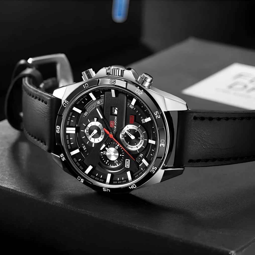 Men's casual wristwatch showing day-date window at 3 o'clock on a black dial with a rose gold case.