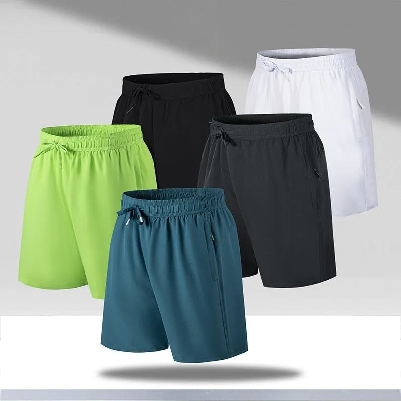 Man wearing loose-fit black quick-drying ice silk polyester beach shorts with an elasticated waist.