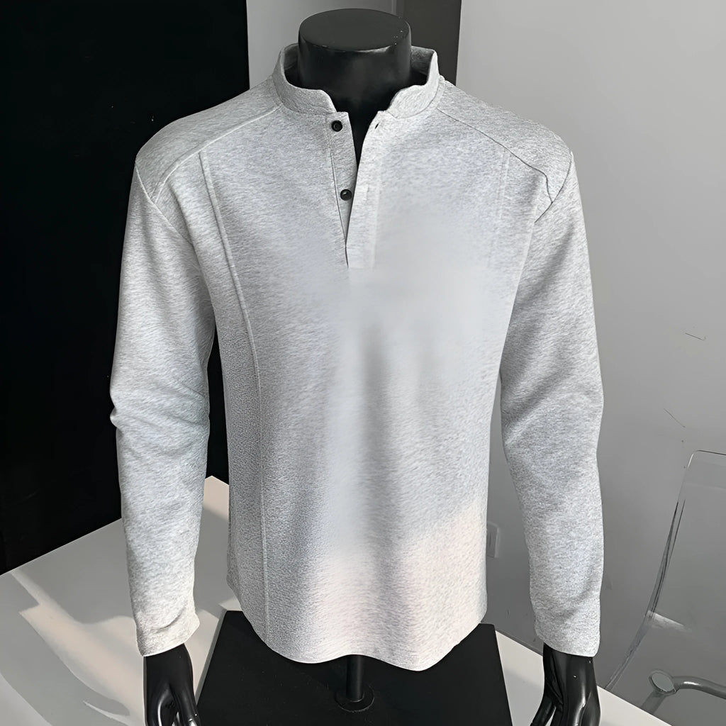 Men's grey asymmetric patchwork polo shirt with a stand-up collar, long sleeves, and a loose fit.