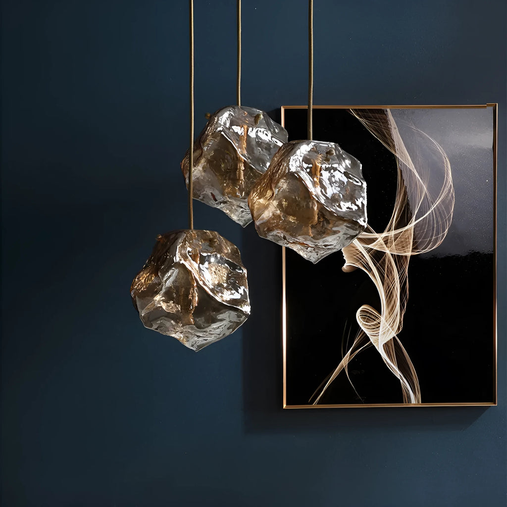 Minimalist ice cube glass chandelier with warm 4000K light, smoky grey shade and black hanging wire over a dining table