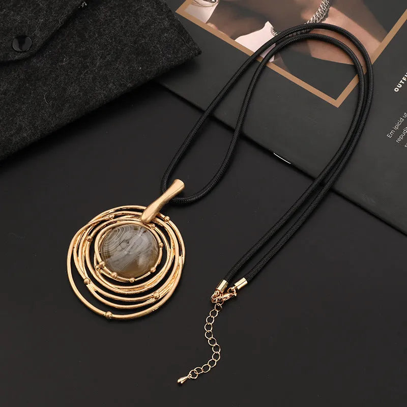 Women's vintage gold adjustable long necklace with geometric plaid alloy pendant on a snakeskin wax rope chain.