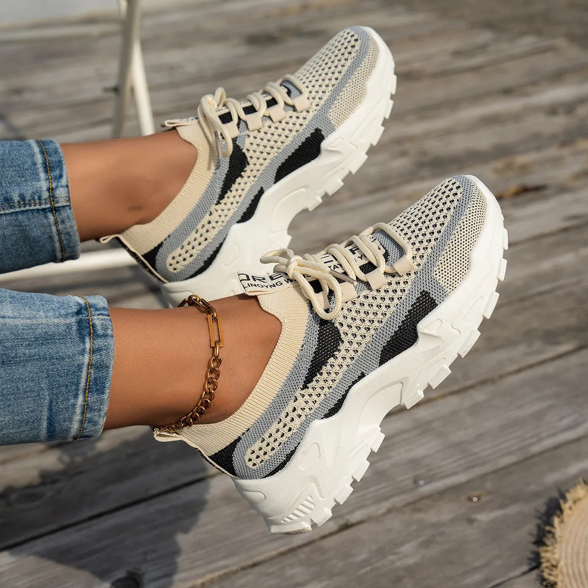 Women's Flyknit mesh lace-up sneakers in various colours with a round toe and rubber sole.