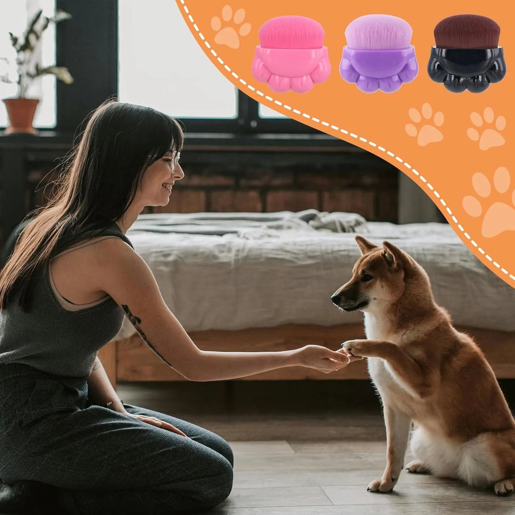 Three pet paw balm brushes with paw-shaped handles in individual storage boxes