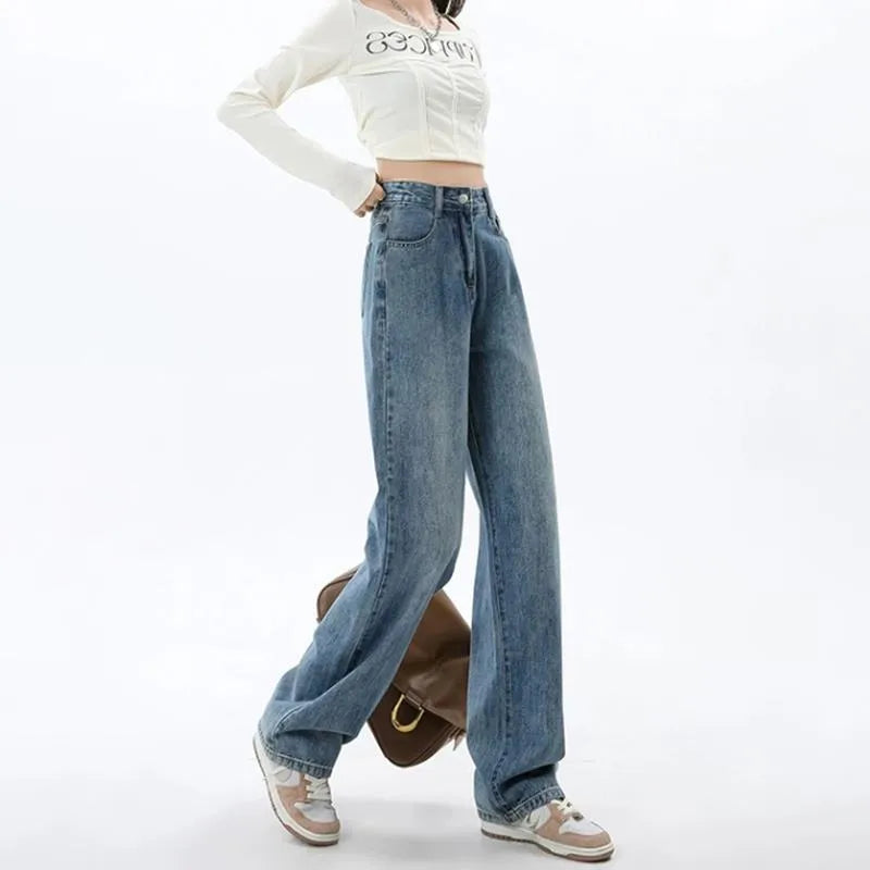 Women's retro blue high-waist wide-leg denim trousers on a hanger, showing straight leg cut.