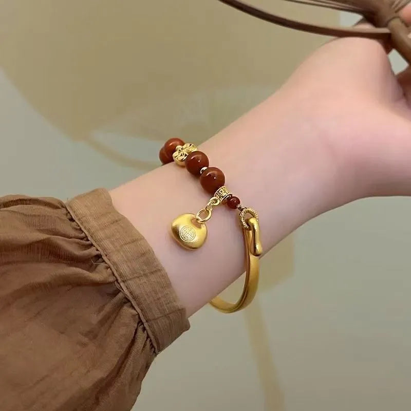 Golden South Red agate lucky bag bracelet with character ingot design for women