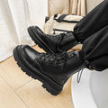 Men's black platform Doc Martens boots with side zipper and 8-hole high-top design.
