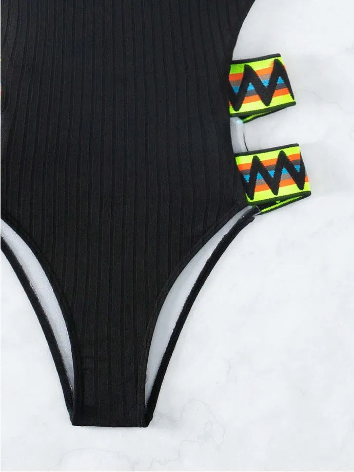 Black solid colour one-piece swimsuit for women on a mannequin, showing full torso coverage and classic swimsuit design.