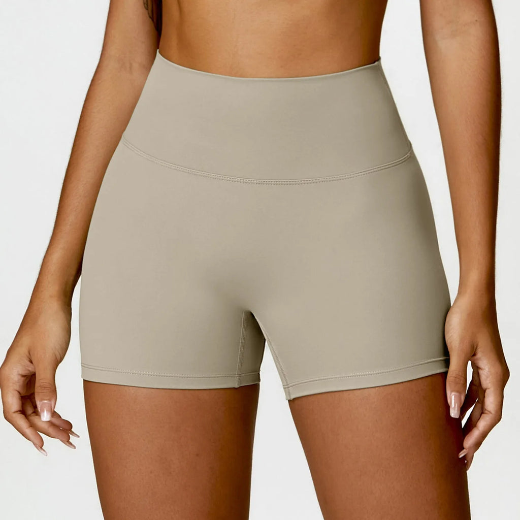 Women's high waist yoga shorts with belly control and peach hip design in nylon fabric