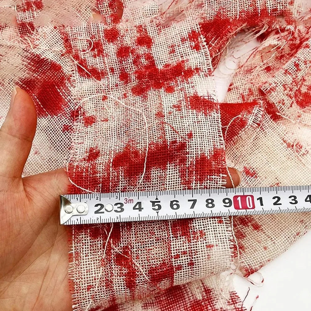 Halloween bloody dyed gauze bandage roll with 8cm width on wooden background