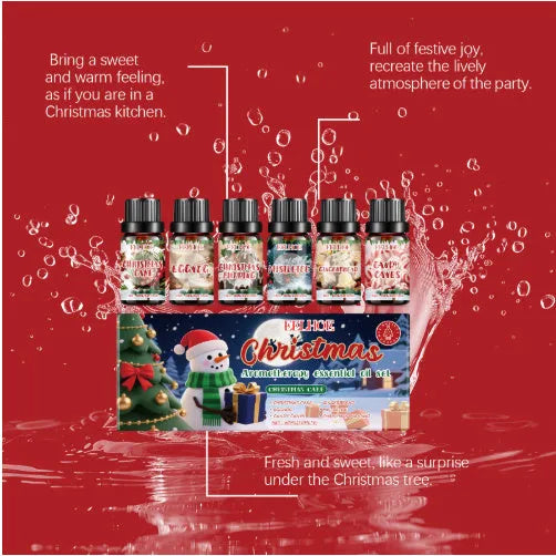 Box containing six small glass bottles of Christmas-themed aromatherapy oils.