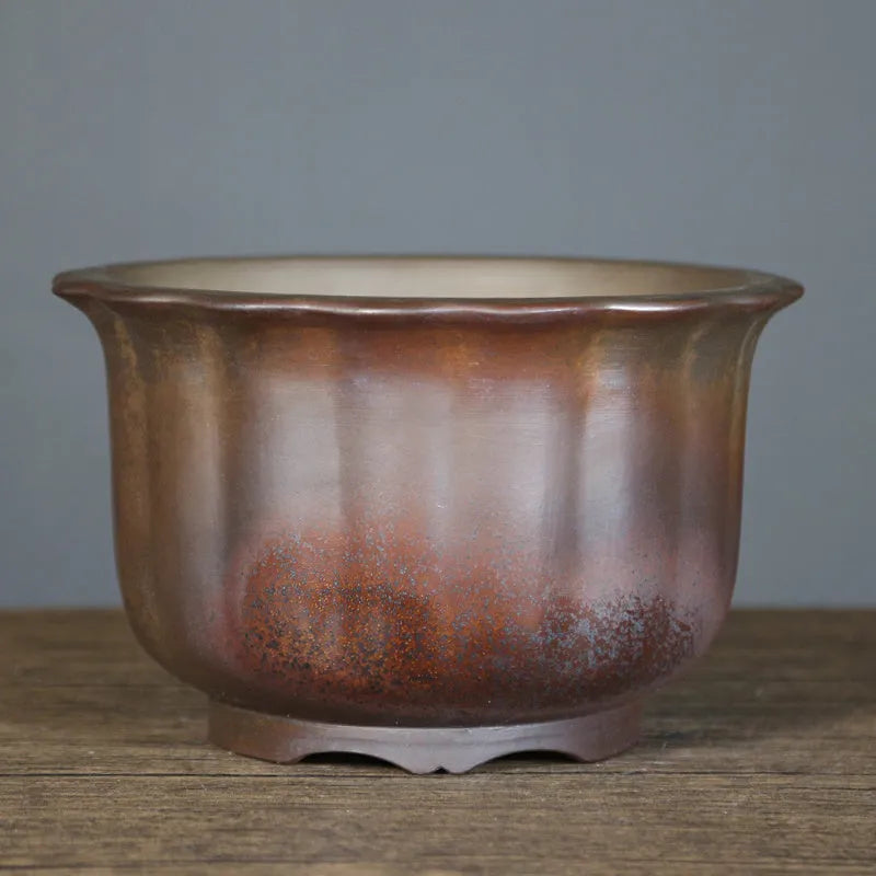 Indoor antique carved ceramic flowerpot in purple sand with a wood-burning finish, shown in large size.