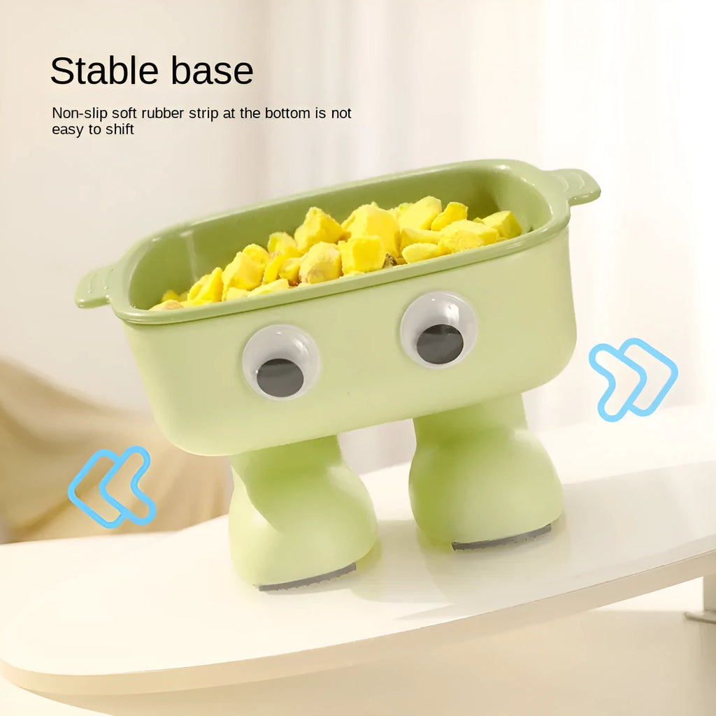 Green robot-shaped elevated cat bowl with tilted food surface and non-slip base
