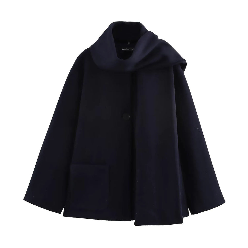 Women's long black polyester overcoat with a fluffy artificial fur collar, shown on a hanger.