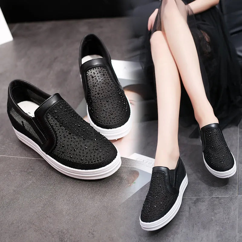 Women's wedge slip-on shoes in black with mesh upper and round toe