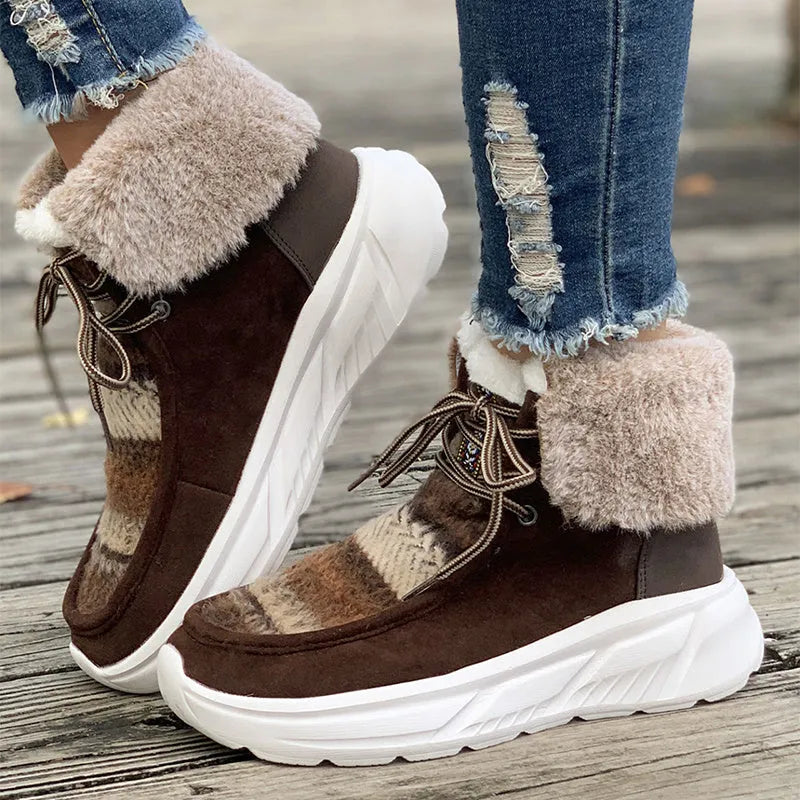 Beige women's mid-top suede snow boots with lace-up front and a thick rubber sole.