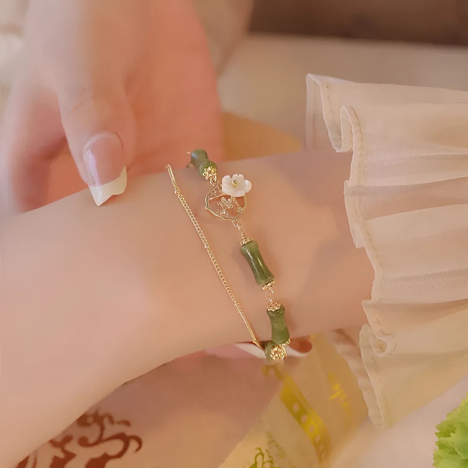 Handmade natural olivine bracelet with Chinese double layer design and olive branch motif.