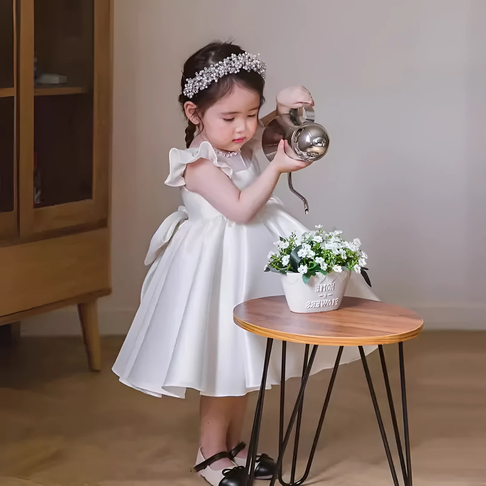Girls' white satin princess dress with puff sleeves, full-length view, white fabric