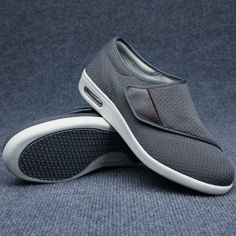 Unisex leisure shoe with hook-and-loop strap on textile upper and foam rubber sole.