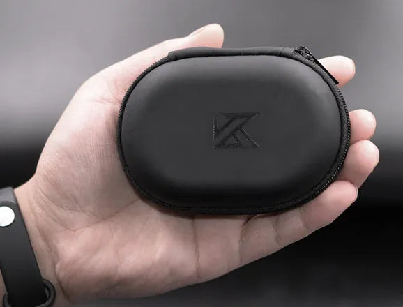 Black oval leather earphone storage bag with a zip closure, open to show soft-lined interior.
