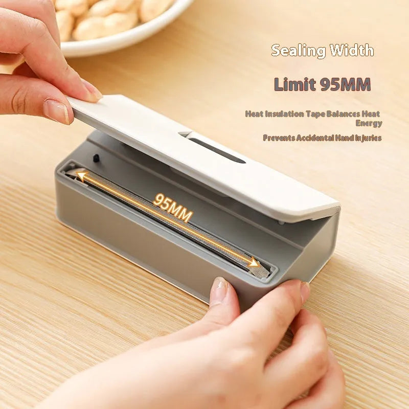 A small white handheld heat sealing machine for plastic bags on a plain background.