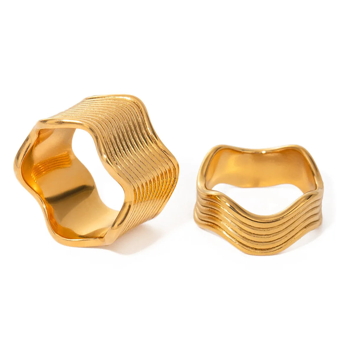 Stainless steel wide band ring with a geometric wave pattern, shown in an electroplated colour option.