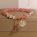 Women's natural strawberry quartz and white agate crystal bracelet with auspicious clouds detailing