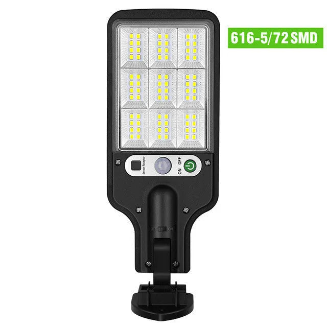Outdoor solar LED wall lamp 28LED variant mounted on a garden fence for patio lighting
