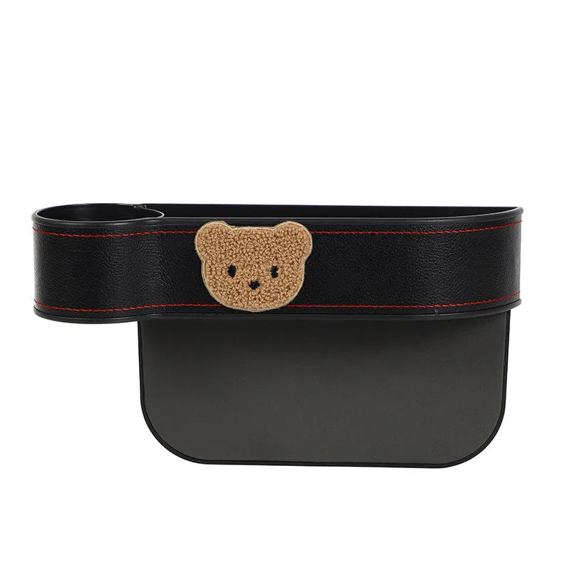 Leather car seat gap storage box with cartoon bear design hanging between vehicle seats